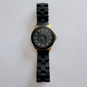 Marc by Marc Jacobs watch.  Black (rubberized texture) with gold accents.